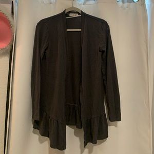 dark gray sweater with ruffle on the bottom